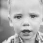 black and white portrait of a child at wedding reception
