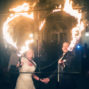 bride and groom lighting up a heart of fire