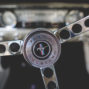 steering wheel of an old ford mustang