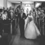 the bride walking down the alley at her father