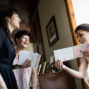 bride showing her love letter to her sister