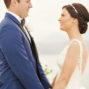 elopement-couple-holding-their-hands-during-the-ceremony-on-santa-irini-at-santorini