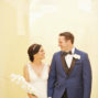 elopement couple walking together in santorini santa irini chapel