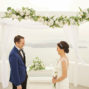 groom and bride elopement ceremony in santorini santa irini chapel