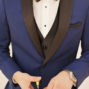 groom-with-blue-tuxedo-cuts-his-havana-cigar